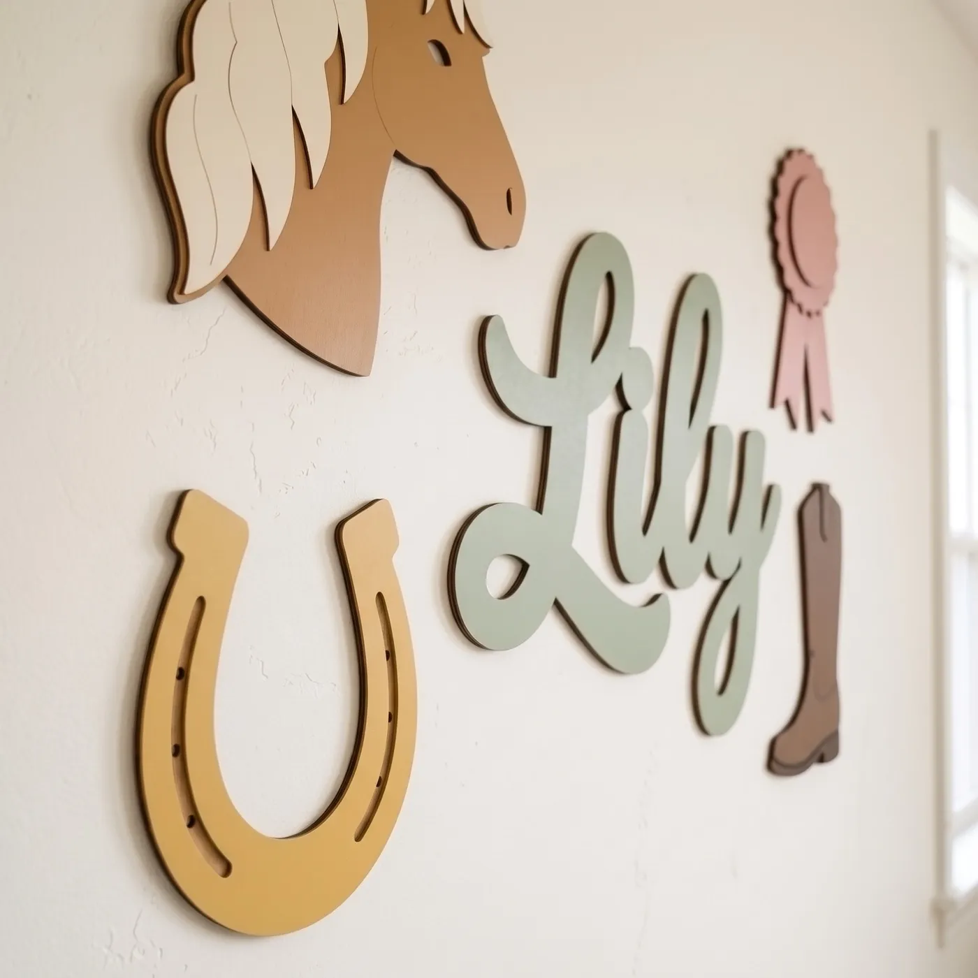 Side view of a painted plywood horse and name sign on a nursery wall